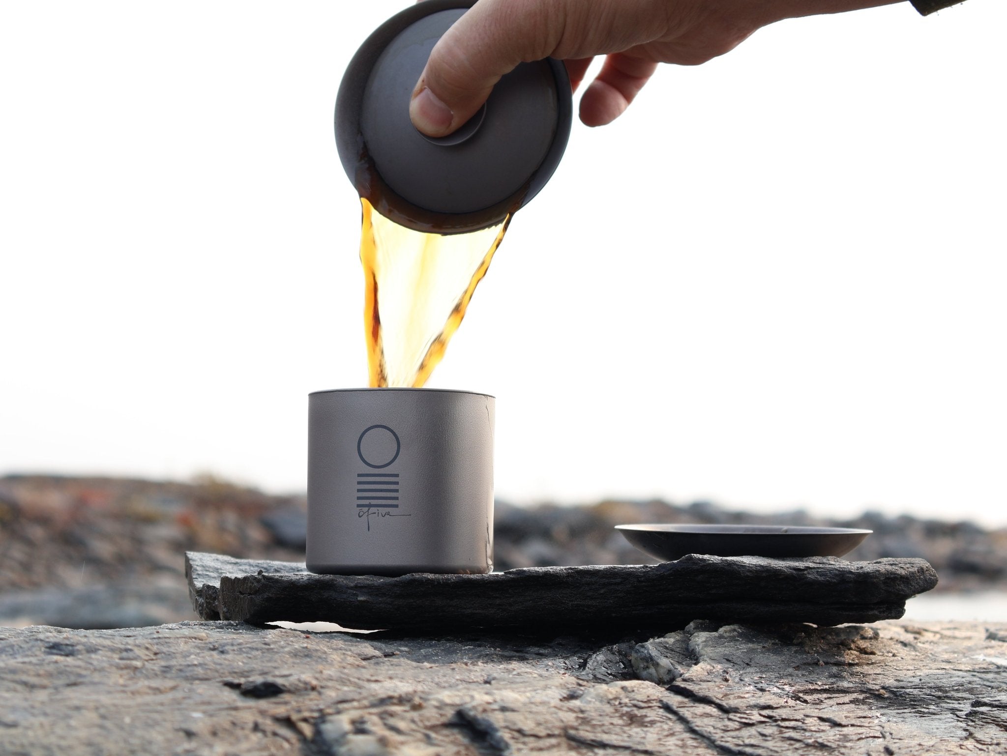 Premium titanium tea ware for loose leaf tea brewing, perfect for travel, outdoor tea sessions, and durable minimalist tea rituals at O5 Rare Tea Bar.